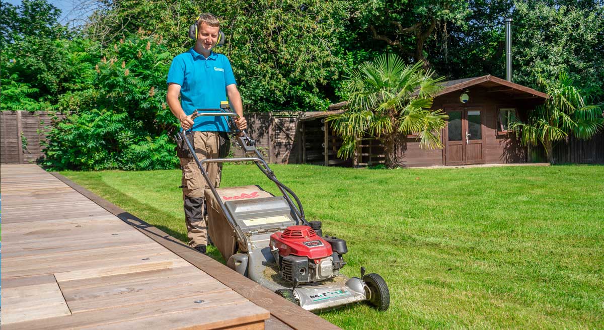 Ben mowing lawn